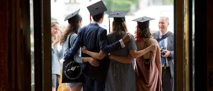 AUC Graduation Ceremony, students with hats from back view